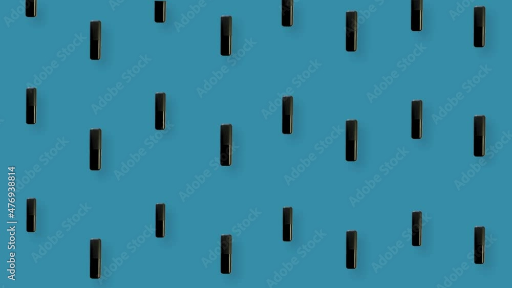 Colorful pattern of lipsticks on blue background. Seamless pattern with lipstick. Top view. Realistic animation. 4K video motion Colorful pattern of lipsticks on blue background. Seamless pattern with lipstick. Top view. Realistic animation. 4K video motion