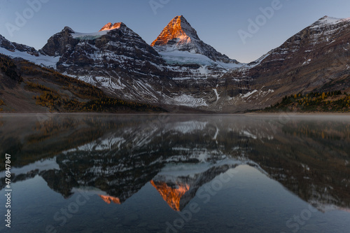 Mount Assiniboine and lake Magog sunrise in larch season