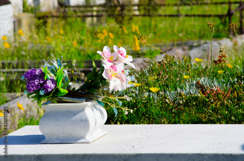 Cemetery vase arrangement with Pink and Purple flowers.