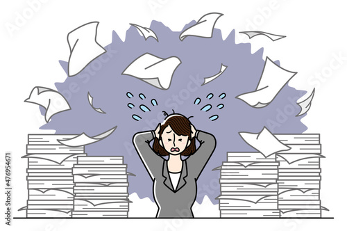 大量の仕事に追われているビジネスウーマン