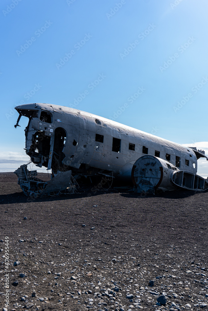 Impressive view of the Sólheimasandur Plane Wreck, the Remains of a 1973 U.S. Navy DC plane that crashed on black sand beach in Iceland