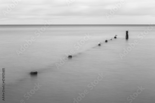 Seascape with breakwater long exposure © Pavel