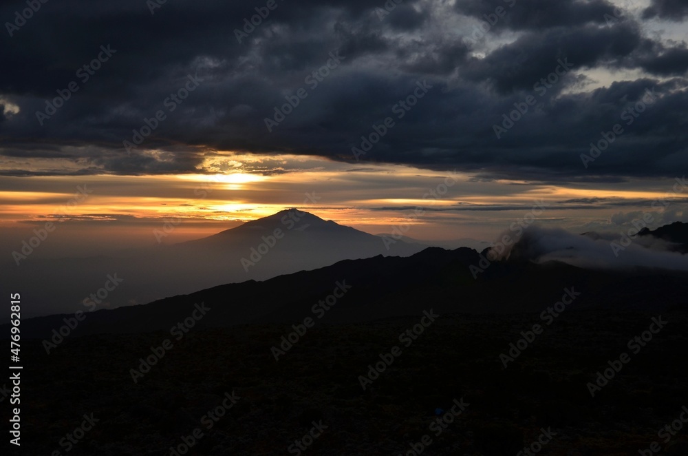 beautiful sunset on the kilimanjaro with a view of mount meru in tanzania shira camp.Hike to the highest mountain afirka
