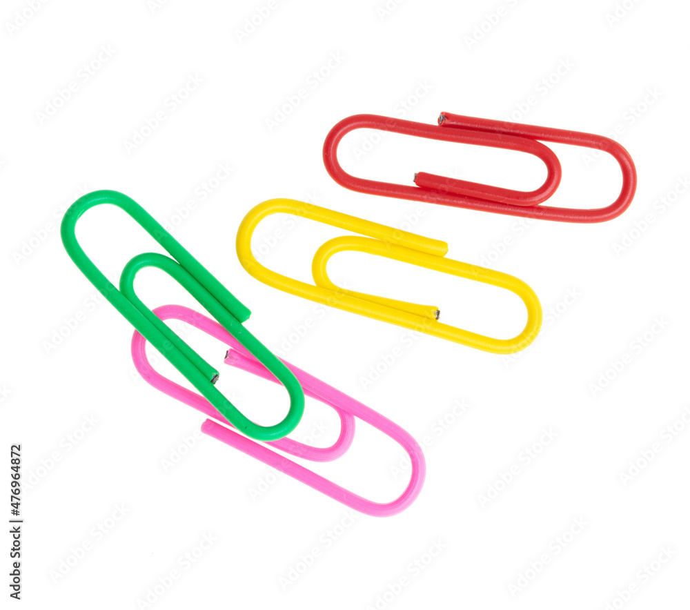 Multi-colored paper clips isolated on a white Multi-colored paper clips isolated on a white