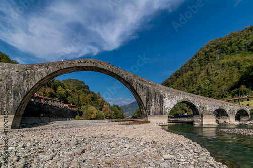 The ancient bridge called Ponte del Diavolo or Maddalena, Lucca, Italy, on a sunny day