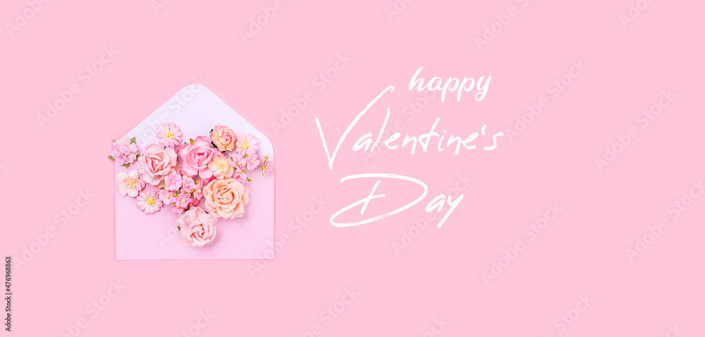 happy Valentine's day ​greeting card. envelope with pink flowers on pink background. gentle minimal composition. banner
