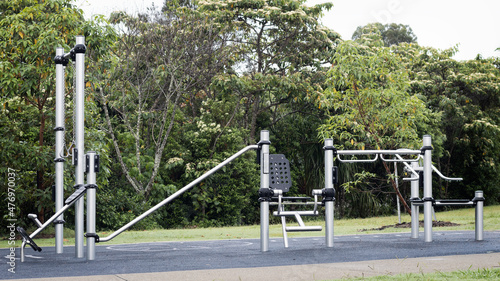 Outdoor Gym Equipment at the park. Healthy lifestyle and Fitness training concept. Public park early morning after the rain. Brisbane, Queensland