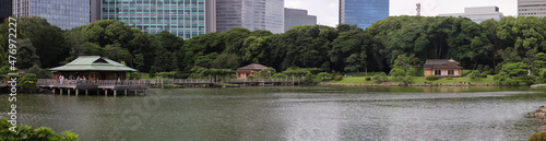 Photography Panorama of the pond at Hamarikyu Gardens with dock and buildings