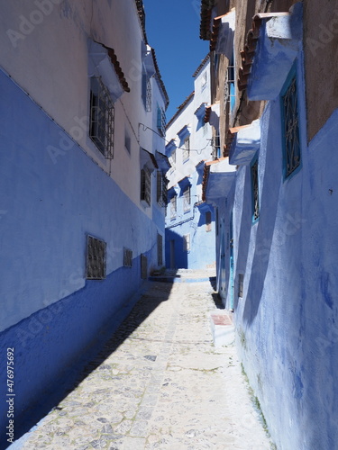 Cosy moroccan alley in Chefchaouen city in Morocco - vertical © Jakub Korczyk