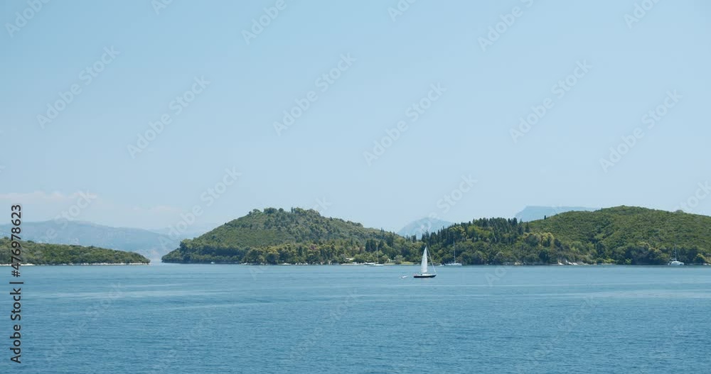 Luxury yacht sailing boat at anchor moored in beautiful bay close to mediterranean Island Luxury yacht sailing boat at anchor moored in beautiful bay close to mediterranean Island