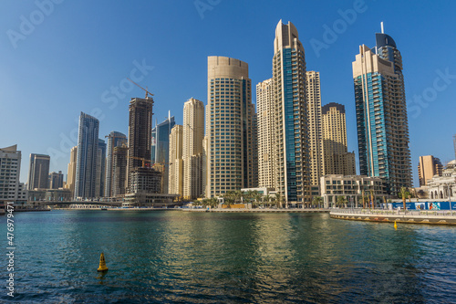 Modern skyscrapers and water pier of Dubai Marina  United Arab Emirates
