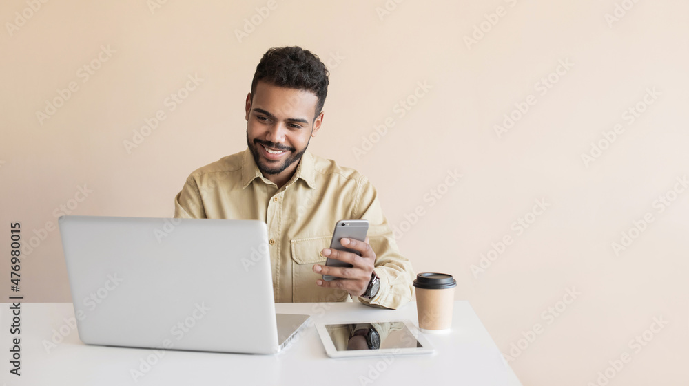 Young man student using laptop computer at home, studying online. Businessman working in office. Distance study, work from home, e-learning, business, creative occupation, meeting online