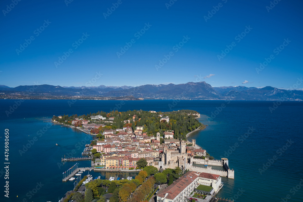 Autumn in Sirmione. Sirmione aerial view. Italian castle on Lake Garda. Top view, historic center of the Sirmione peninsula, lake garda. Aerial panorama of Sirmione. Lake Garda, Sirmione, Italy.