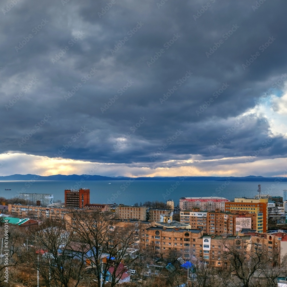 view of the city at sunset from hill