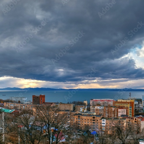 view of the city at sunset from hill