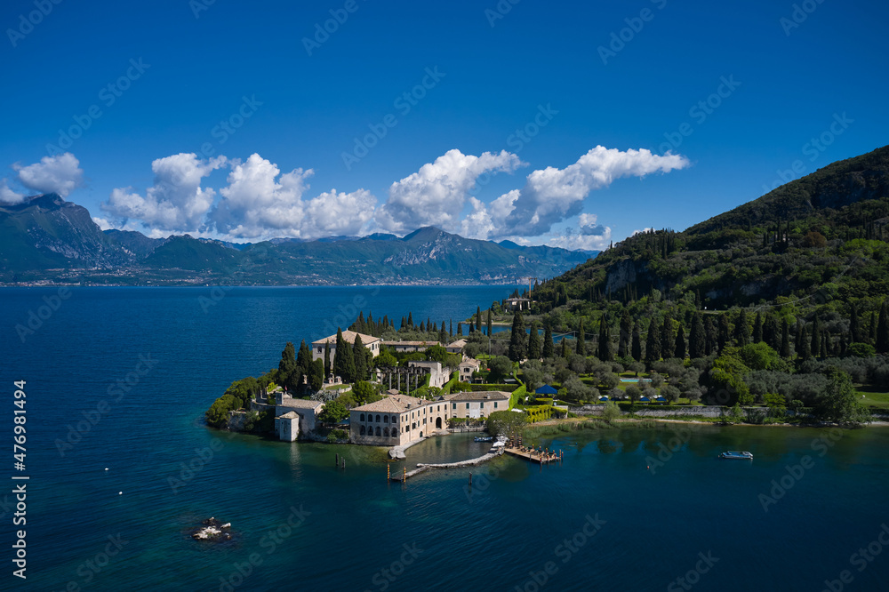 Aerial view of Parco Baia delle Sirene, Lake Garda, Italy. Panorama of punta san vigilio. Baia delle Sirene on the coastline. Top view of baia delle sirene on the coastline of Lake Garda.