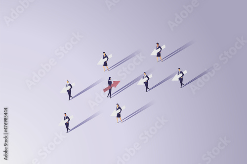 Businesswoman holding arrow walking in the opposite direction to group businessmen holding arrows.