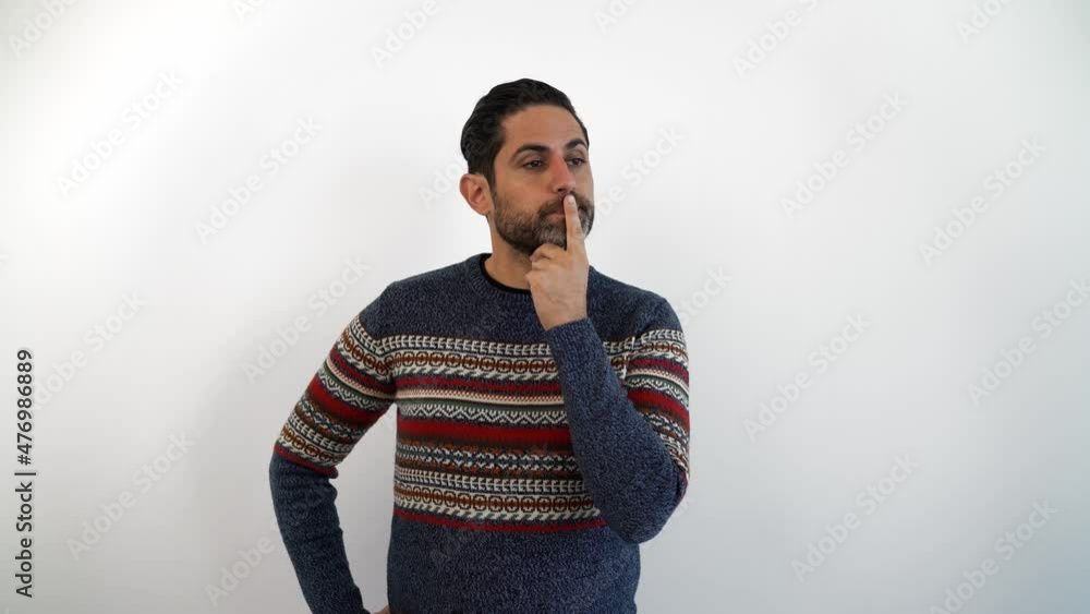 Portrait of scaring frightening caucasian man with a beard at indoor studio shot. Terrifying guy looking at camera closing ears isolated white background Portrait of scaring frightening caucasian man with a beard at indoor studio shot. Terrifying guy looking at camera closing ears isolated white background