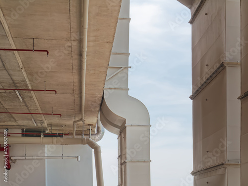 Low Angle View of Vertical White Air Ducts Mounted on the Building