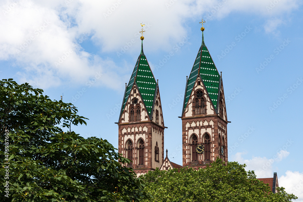 Twin towers of the Sacred Heart Church Herz-Jesu-Kirche in Freiburg im Breisgau, Baden-Wuerttemberg, Germany