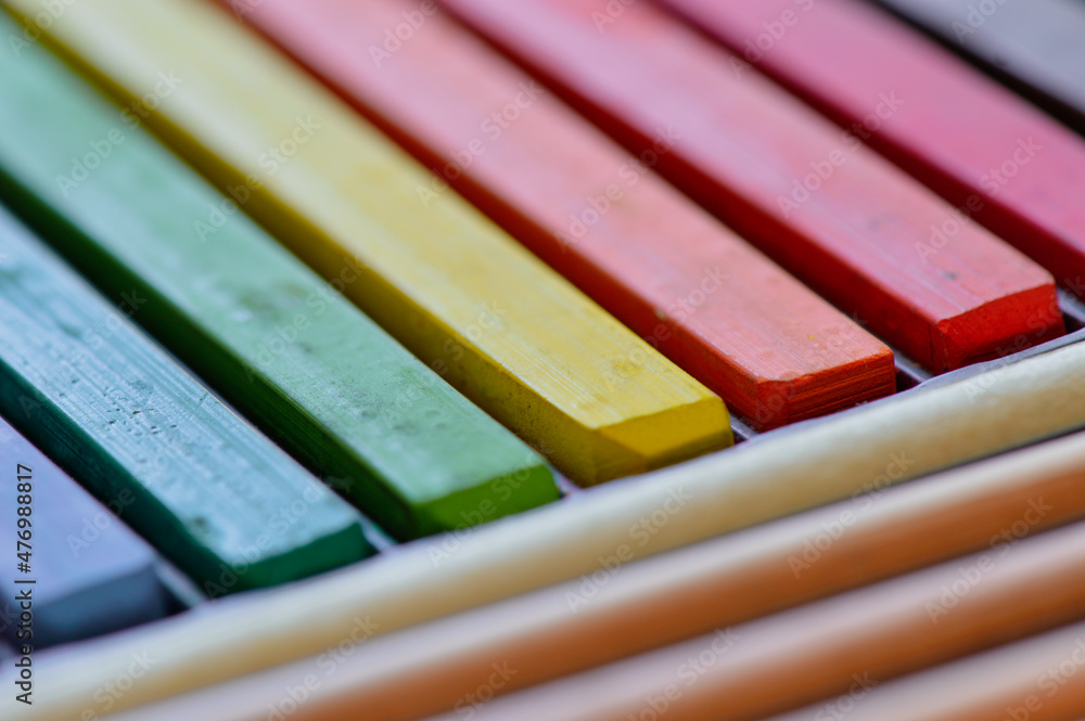 Coloured chalk pastel sticks, abstract colourful background, artistic, rainbow colours, soft focus Coloured chalk pastel sticks, abstract colourful background, artistic, rainbow colours, soft focus