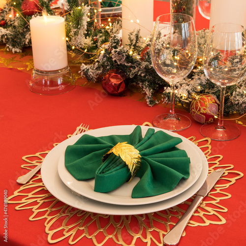 Beautiful table setting with Christmas decorations. Red colors