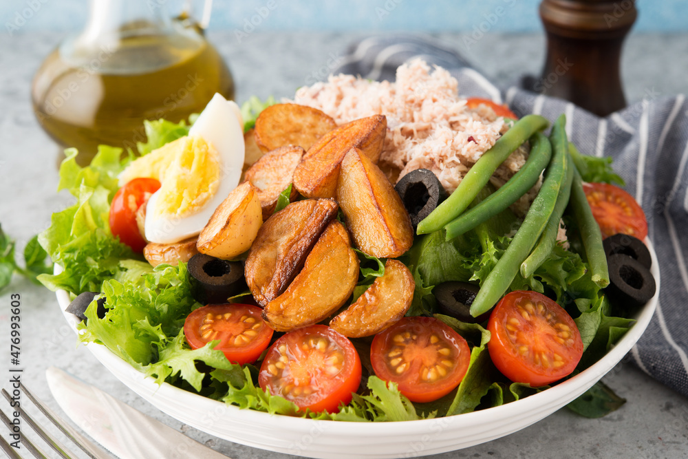 Nicoise salad with tuna, beans, vegetables and potatoes
