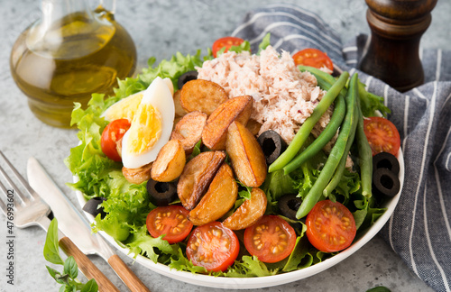 Nicoise salad with tuna, beans, vegetables and potatoes