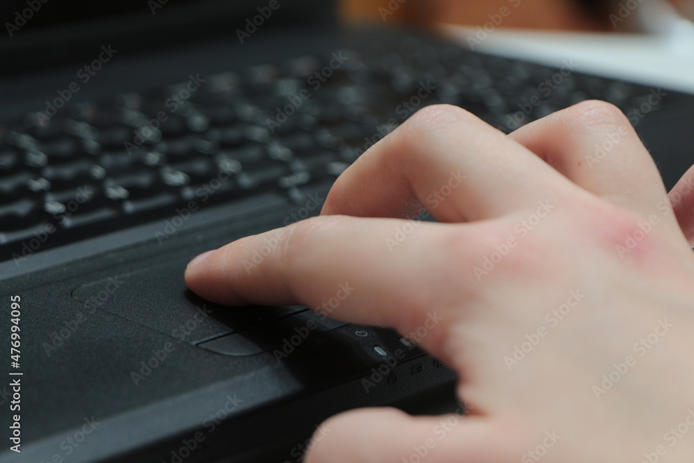 Hand on the laptop. Working at home office. Hand on keyboard. Close up. Hand on the laptop. Working at home office. Hand on keyboard. Close up.