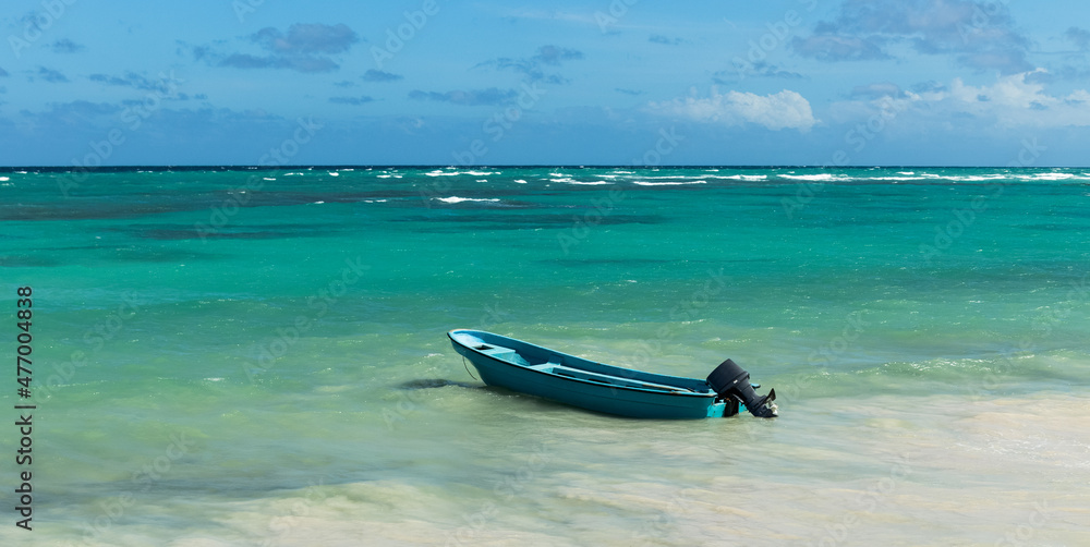 Fototapeta premium Small motorboat in the turquoise sea.