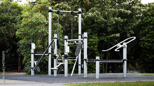 Outdoor Gym Equipment at the park. Healthy lifestyle.  Ideal for weight loss and improving overall fitness. Public park at dawn after the rain. 