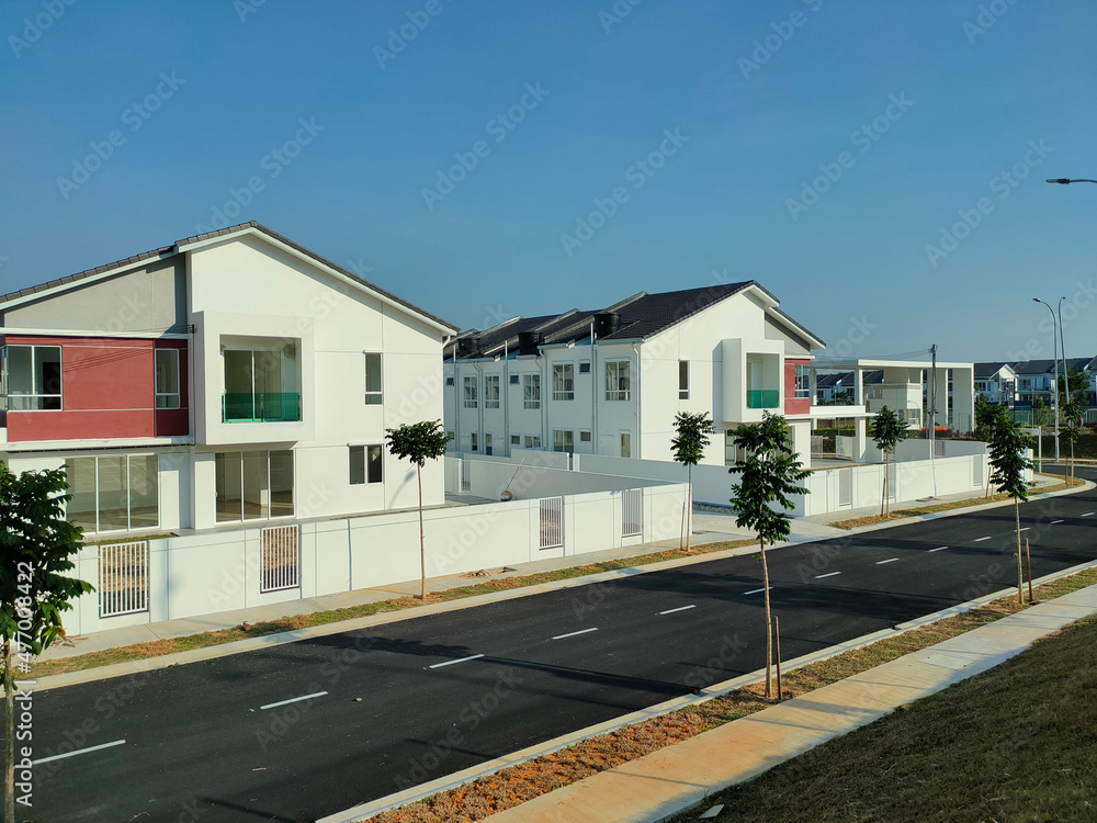 SEREMBAN, MALAYSIA -APRIL 16, 2020: Selected focused on new double story terrace house under construction in Malaysia. Designed by an architect with a modern and contemporary style. SEREMBAN, MALAYSIA -APRIL 16, 2020: Selected focused on new double story terrace house under construction in Malaysia. Designed by an architect with a modern and contemporary style.