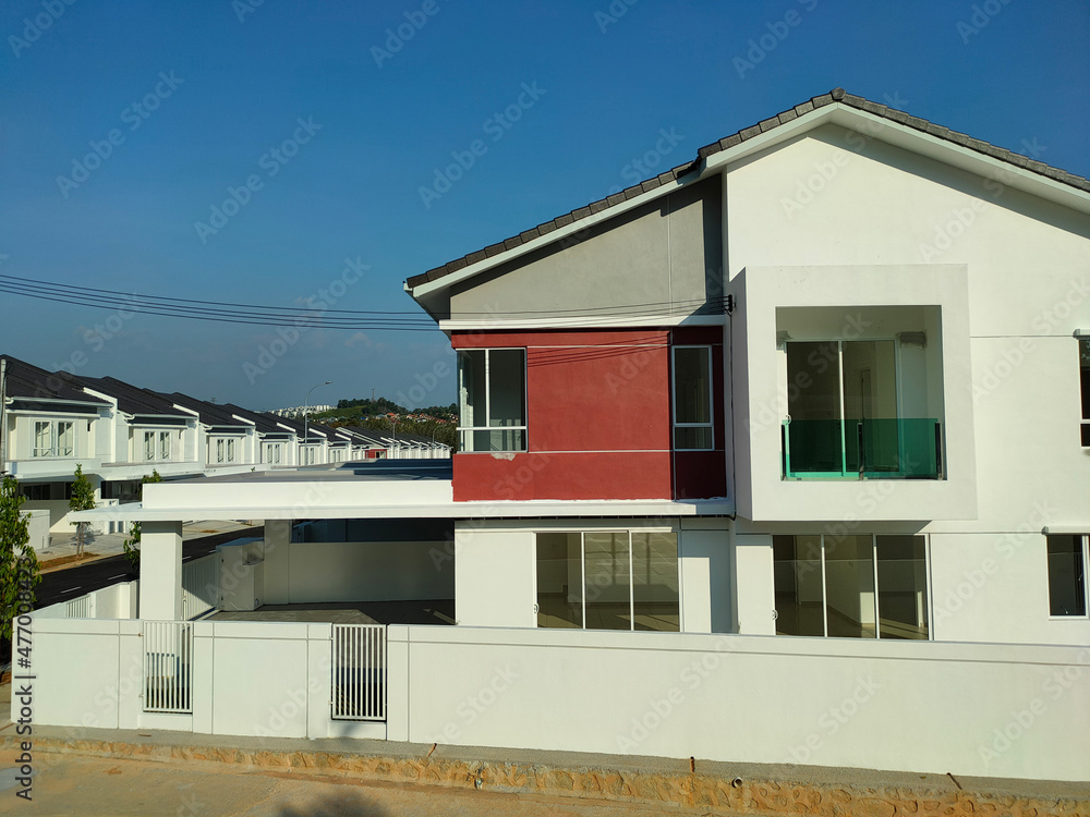 SEREMBAN, MALAYSIA -APRIL 16, 2020: Selected focused on new double story terrace house under construction in Malaysia. Designed by an architect with a modern and contemporary style. SEREMBAN, MALAYSIA -APRIL 16, 2020: Selected focused on new double story terrace house under construction in Malaysia. Designed by an architect with a modern and contemporary style.
