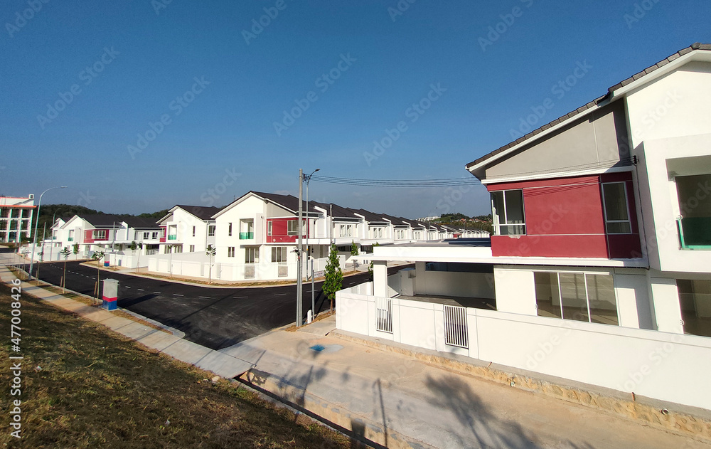 SEREMBAN, MALAYSIA -APRIL 16, 2020: Selected focused on new double story terrace house under construction in Malaysia. Designed by an architect with a modern and contemporary style. SEREMBAN, MALAYSIA -APRIL 16, 2020: Selected focused on new double story terrace house under construction in Malaysia. Designed by an architect with a modern and contemporary style.
