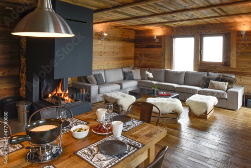 Warm chalet living room with a corner couch photo