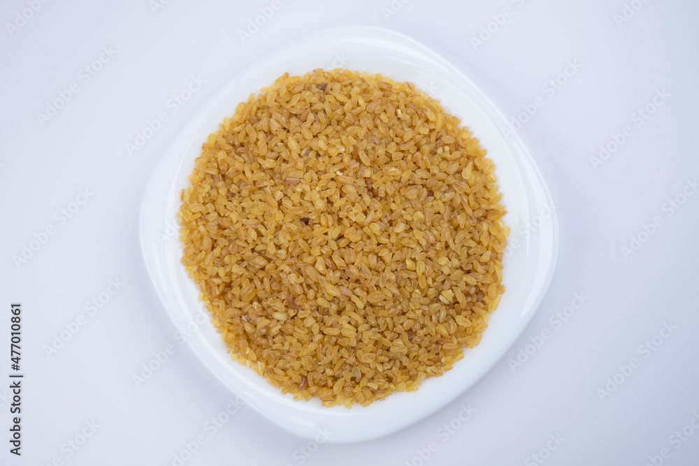 Bulgur on white plate close-up Bulgur on white plate close-up