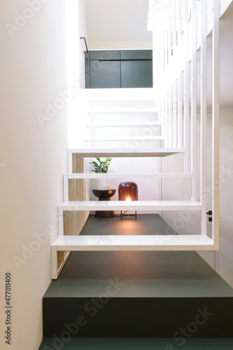 Beautiful luminous interior designed black and white staircase