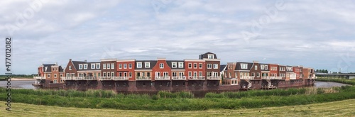 Obraz na płótnie Modern residential area. Typical traditional dutch architecture style houses forming one district encircled by water. Gouda, Netherlands w salonie