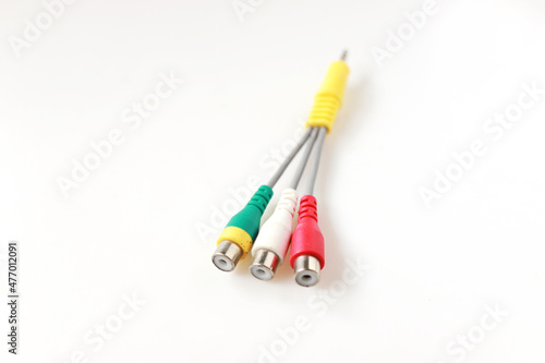 Three color Audio video cable RCA to 3.5mm jack isolated on white background. input connectors to back of speaker video and stereo sound.