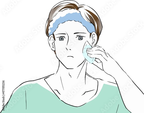 化粧水をつける若い男性