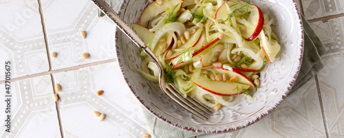 salad plate with apple, fennel and celery on the table