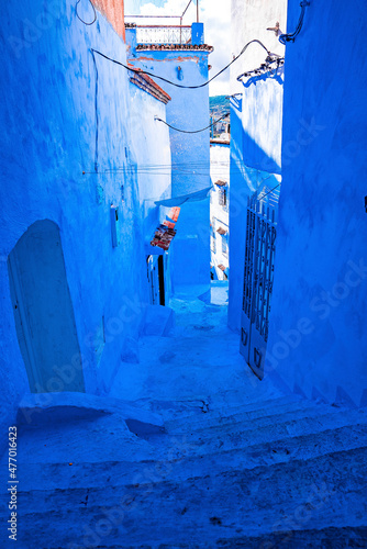 Street with staircase and building of old traditional town at Chefchaouen, the blue city in the Morocco © Aerial Film Studio