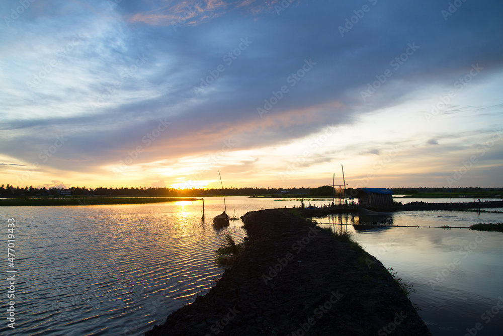Obraz premium Beautiful sunset backwaters photography, Sunset beach Photography view from Kadamakudy Kerala, India, Seascape photography