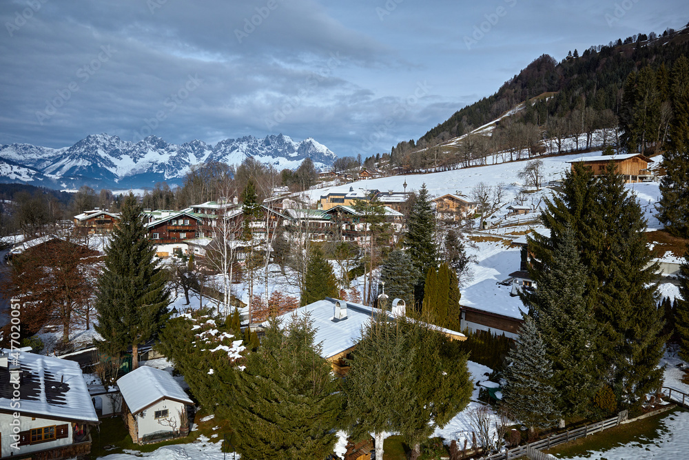 Houses surrounded by fir trees in Kitzbühel, Tirol, Austria