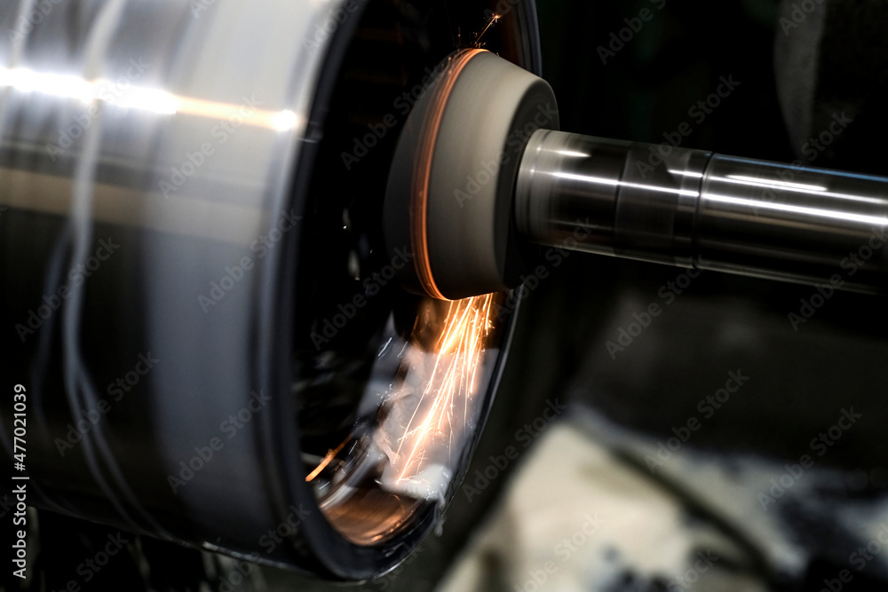 Fototapeta premium When grinding an internal cylindrical part in a circle on the machine, coolant is poured.