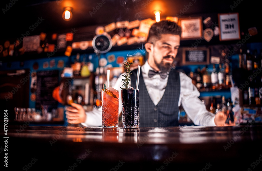 Bartender makes a cocktail at the public house