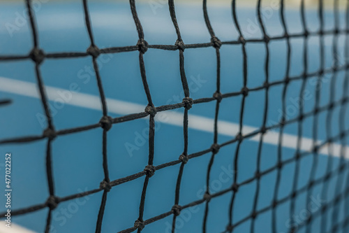 Paddle tennis net and hard court. Tennis compettion concept