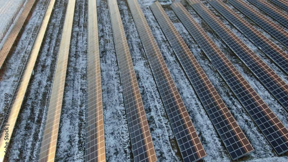 Solar panels in winter during sunset Solar panels in winter during sunset