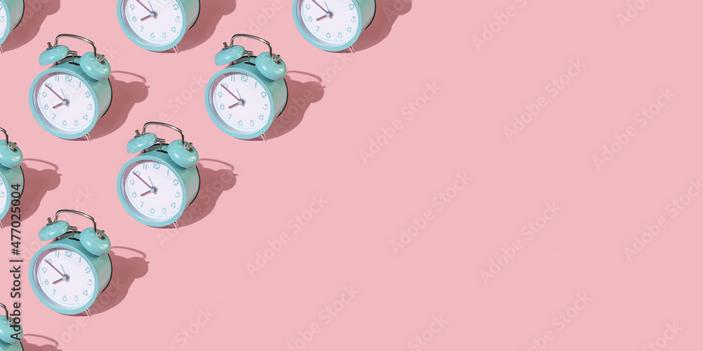 Banner from alarm clocks on a pink background. Banner from alarm clocks on a pink background.