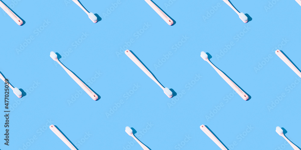 Toothbrushes pattern on a blue background. Toothbrushes pattern on a blue background.
